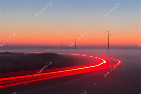 Long Exposure Red Car Light Trails On A Road Stock Photo By ©daliu 95794090