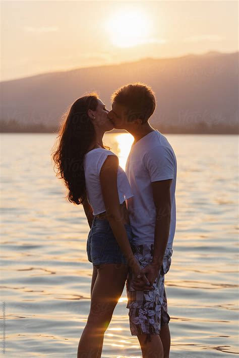 Young Couple Kissing By Stocksy Contributor Michela Ravasio Stocksy