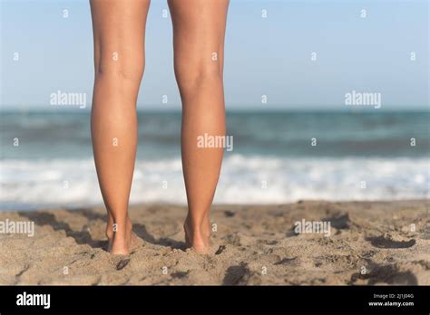 Female Barefoot Legs On Sandy Beach Near Waving Sea Stock Photo Alamy