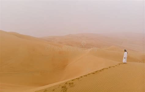 Arab Man Walking In A Desert Stock Photo Image Of Dhabi Keffeyah