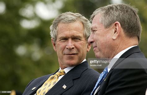 President George W Bush Stands With Attorney General John Ashcroft