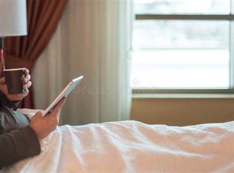 Checking The Morning News On Tablet In Hotel Room Stock Photo Image Of Routine Wifi