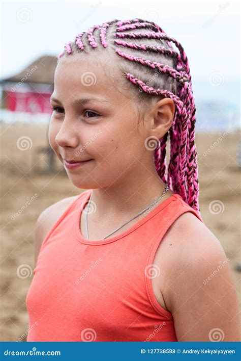 Portrait Of Beautiful Girl With Pink Dreadlocks Standing Outdoor Stock