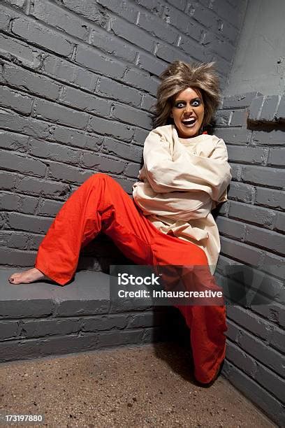 Crazy Woman Wearing A Straight Jacket In An Asylum Stock Photo