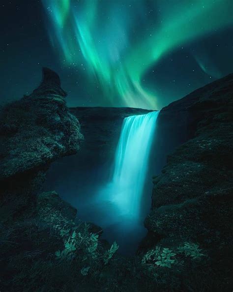 Magical Aurora Borealis Above A Waterfall In Iceland By Aritzatela