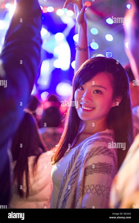 Happy Young Chinese Woman At Music Festival Stock Photo Alamy