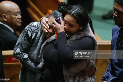 Mourners Comfort One Another During The Funeral For Freddie Gray At