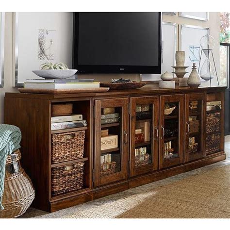 The 16 glass door cabinet fits components up to 14 wide and is perfect for storing baskets of dvds, video game consoles that stand vertically, games or other related items. Pottery Barn Printer's Media Stand | Chairish