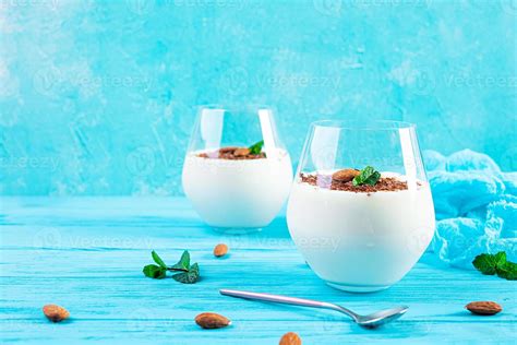Sweet Milk Pudding With Almonds And Chocolate Chips On Blue Background