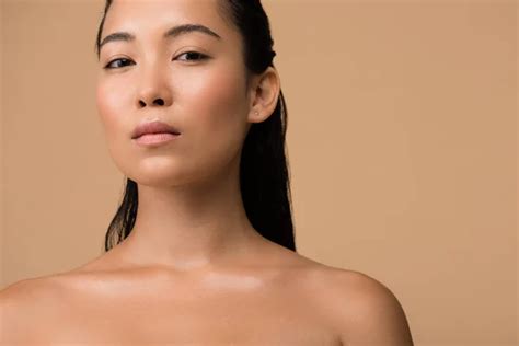 Beautiful Naked Asian Girl Looking Away Touching Face Isolated Beige Stock Photo By