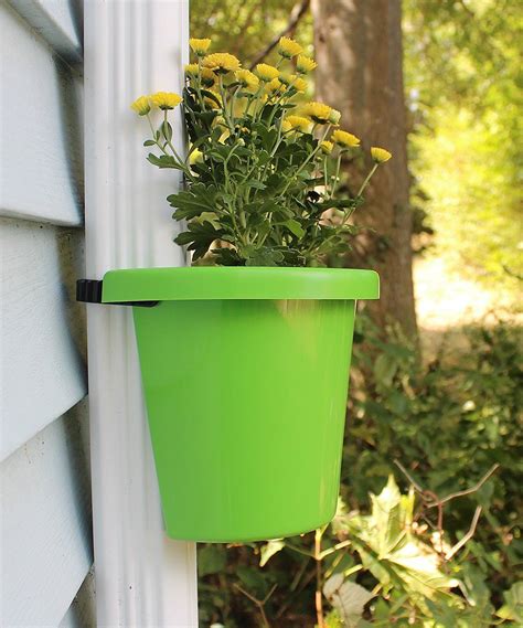 Spruce Up An Unappealing Downspout With This Innovative Hugging Planter