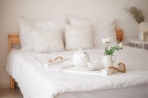 Cozy Bedroom In Light Colors Flowers Breakfast In Bed Stock Image