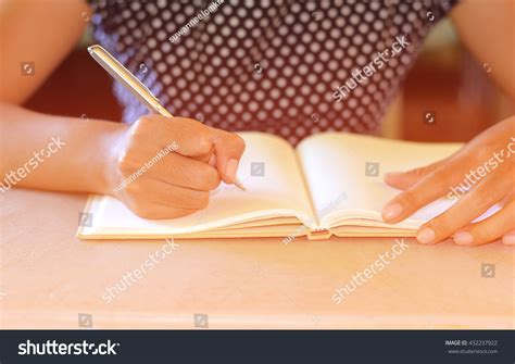 Womans Hand With Pen Writing On Notebook Stock Photo 432237922 Shutterstock
