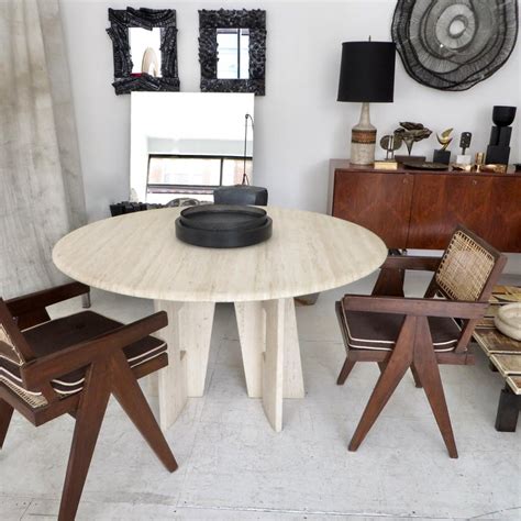 This charming table includes a marble inspired top and base, oval design style and chrome banding accents to create a warm and appealing entertainment setting. Italian Round Travertine Marble Dining Table with ...