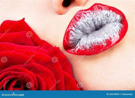 Beautiful Female Lips With Shiny Lipstick And Red Rose Stock Photos