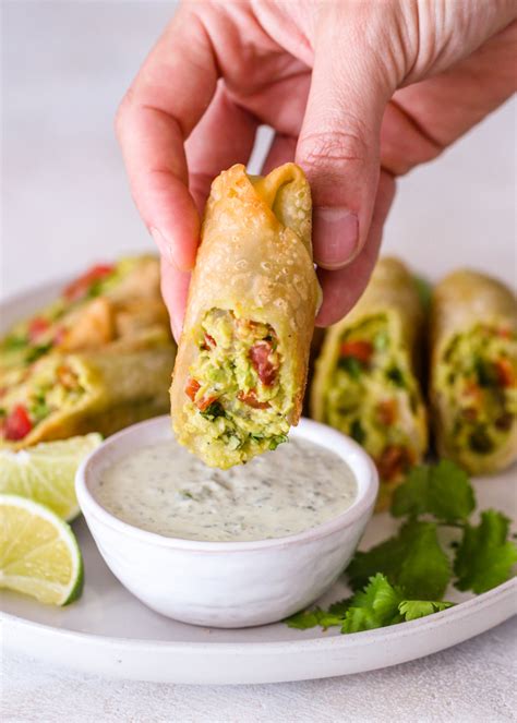 Grab the food and drop it into the pot. Avocado Egg Rolls | Gimme Delicious