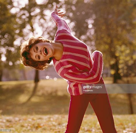 American Actress Elizabeth Ashley Posed Wearing A Striped Pink Jumper