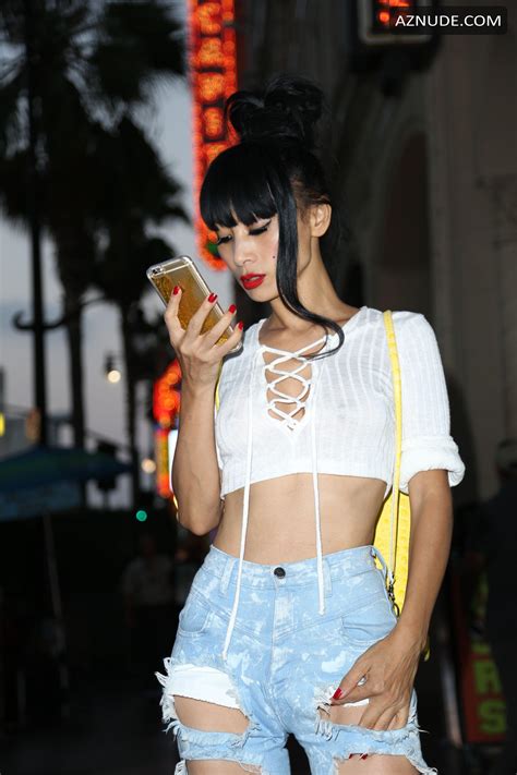 Bai Ling Braless In A White Top And Ripped Jeans In Los