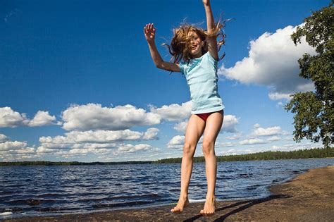 Nine Year Old Girl Jumping In The Air At License Image Lookphotos
