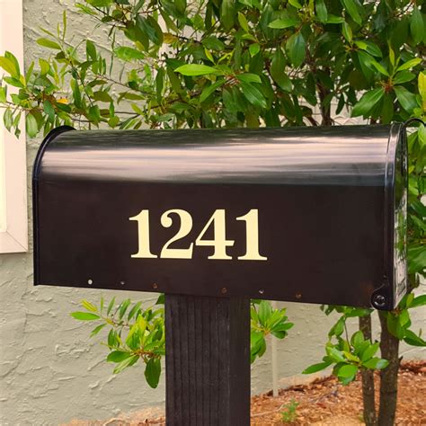 You will receive four decals, two numbers. Antiqua traditional style mailbox numbers