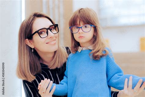Mother And Daughter Wearing Eyeglasses In An Ophthalmology Clinic Mom