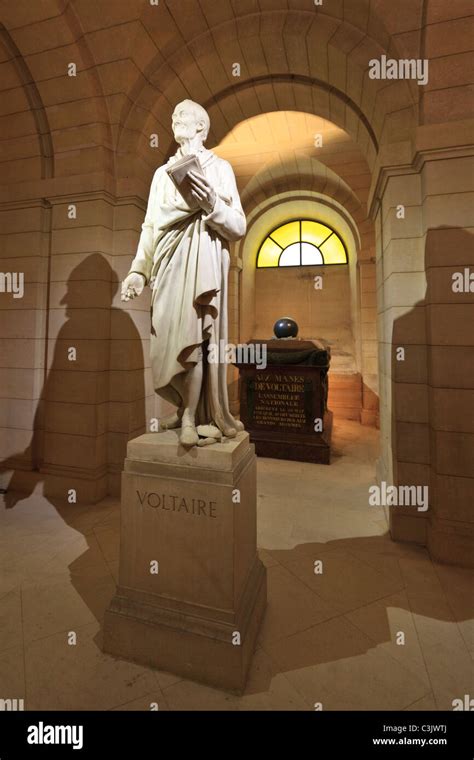 A Statue Of Voltaire And His Tomb In The Crypt Of The Pantheon Paris
