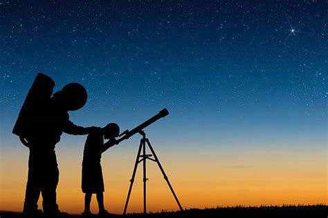 Person Looking Through Telescope Stock Photos Pictures And Royalty Free