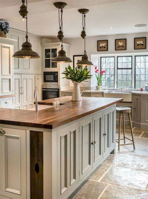 Hefty beamed ceilings and unique lanterns it really embodies the real farmhouse although some parts of this kitchen denote modern style. Nice 40 Rustic Modern Farmhouse Kitchen Design Ideas https ...