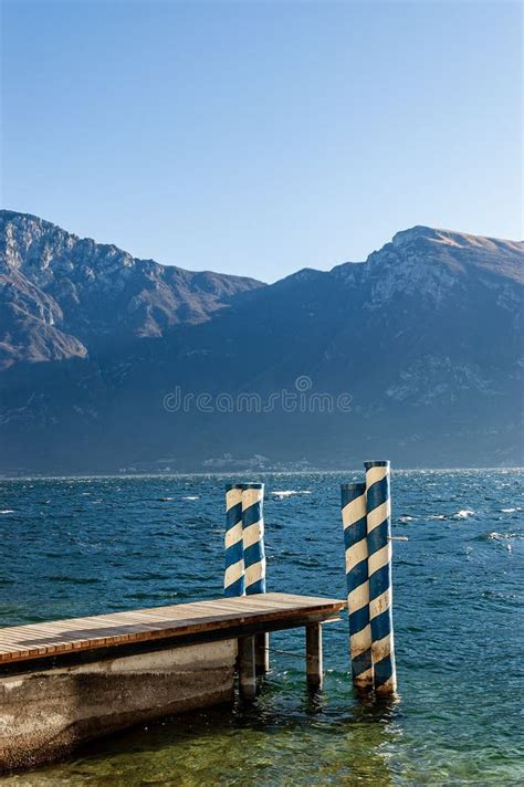 Small Wooden Jetty Lake Garda And Baldo Mountain Italy Stock Photo