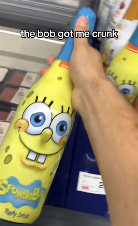 someone is holding two toothbrushes in the shape of spongebob cartoon characters