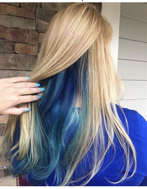 blue vivids under long blonde dyed blonde hair blonde and blue hair underlights hair