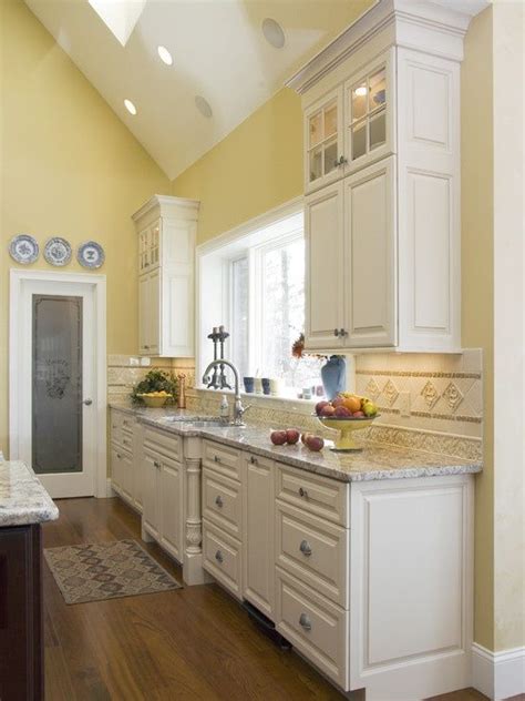 Kitchen Design Pairing Yellow Walls With Marble Countertops And
