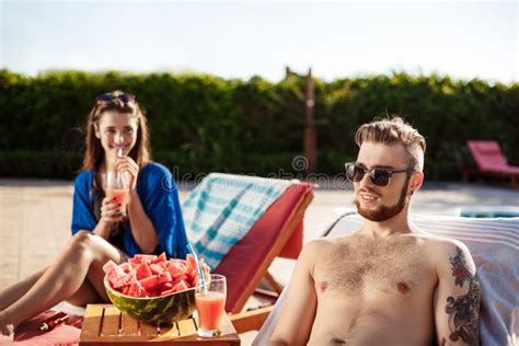 Friends Smiling Resting Drinking Cocktails Lying Near Swimming Pool Stock Image Image Of