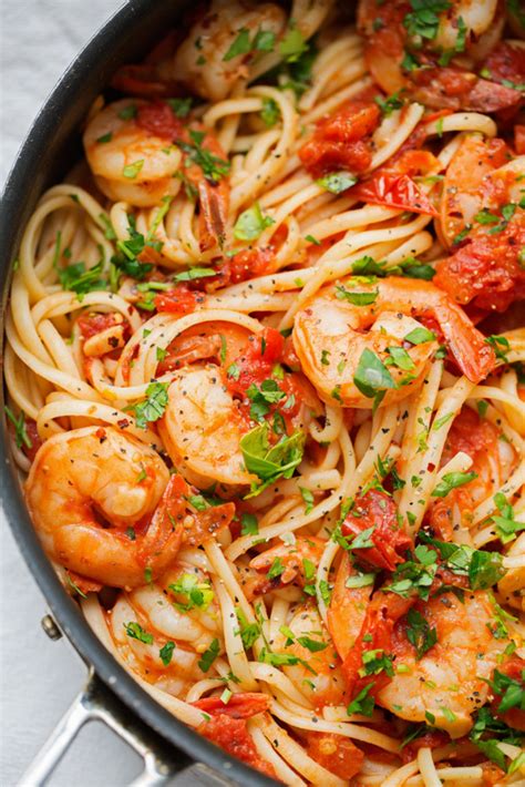 Everybody understands the stuggle of getting dinner on the table after a long day. Summer Time Shrimp Pasta with Spicy Garlic and Tomatoes ...