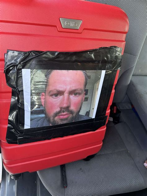 Woman Picks Up Luggage After Southwest Flight Finds Photo Of Man Taped To The Side View From