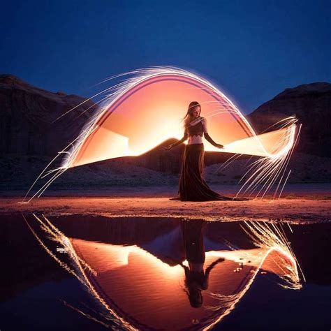 Light Painting Duo Captures Dreamy Photographs As Lighting Strikes