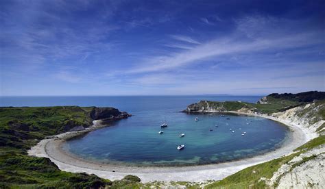 From middle english cove, from old english cofa (chamber; Lulworth Cove - Britain ExplorerBritain Explorer