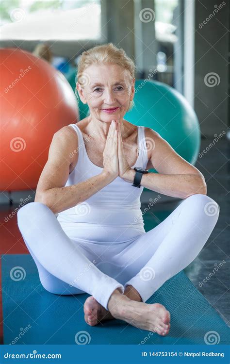 Senior Woman Doing Yoga In Fitness Gym Aged Lady Exercising Old