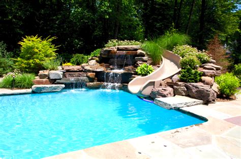 Installation of the playing tools and structures around the swimming facilities is considered a great idea. Custom Pool Slides - Summit USA - Commercial Luxury Custom ...