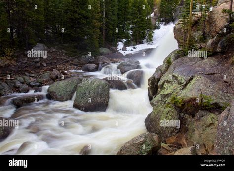 A High Volume Of Water Flows Through Glacier Creek At Alberta Falls