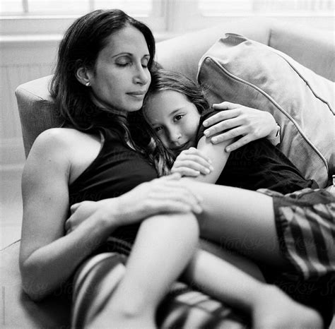 Black And White Photo Of Mother And Daughter Relaxing Together By Stocksy Contributor Jakob