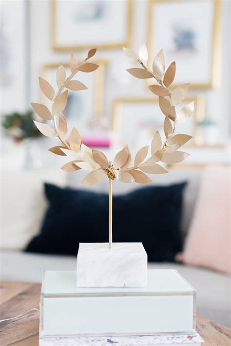The word wreath is drawn from an old english word writhen meaning. DIY Gold Laurel Wreath on Stand