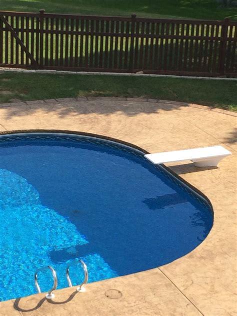 Stamped And Colored Concrete Pool Deck With Custom Chiseled Stone Cantilevered Coping By Sierra