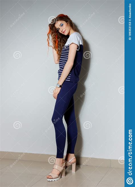 Full Length Portrait Of Trendy Hipster Girl With Long Legs In Tight