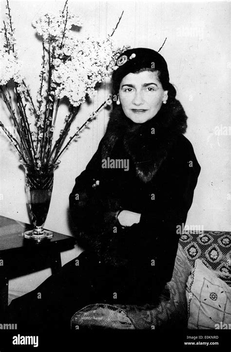 Portrait Of Fashion Designer Coco Chanel On A Trip To London Stock