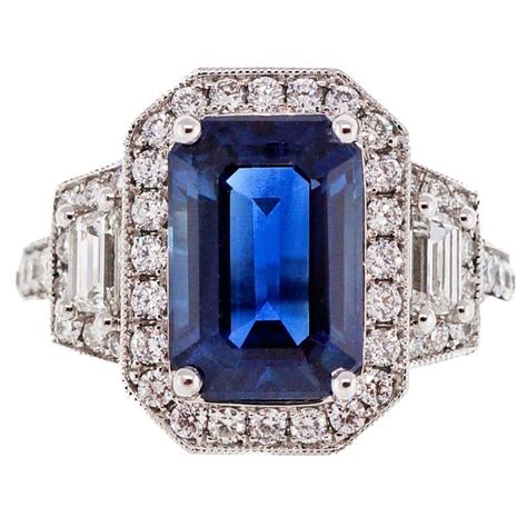 Peter Suchy Emerald Step Cut Sapphire Halo Diamond Platinum Ring For