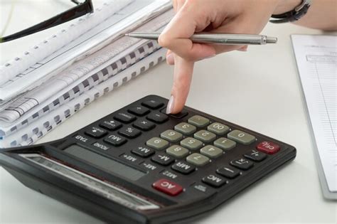 Premium Photo Close Up Of Female Accountant Making Calculations