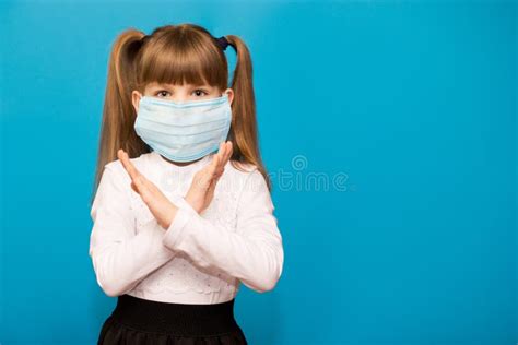 Little Girl Wearing Medical Mask For Protect With Two Arms Crossed Show
