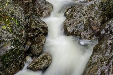 Long Exposure Of Water Rushing Over Rocks Stock Image Image Of
