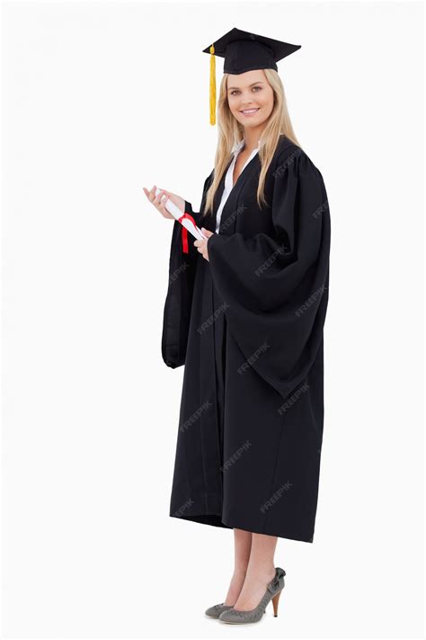 Premium Photo Blonde Student In Graduate Robe Holding A Diploma